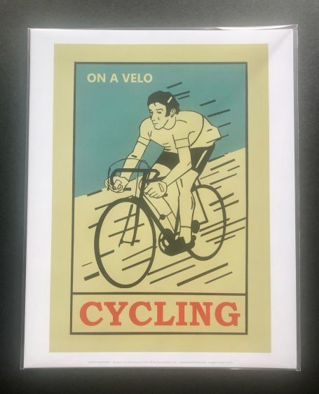 Vintage-style poster of a cyclist riding a bicycle with the text "CYCLING."