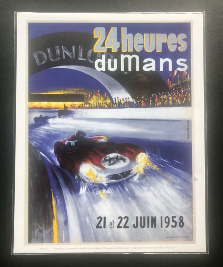 Poster for the 1958 24 Hours of Le Mans, featuring a racing car in a night scene.